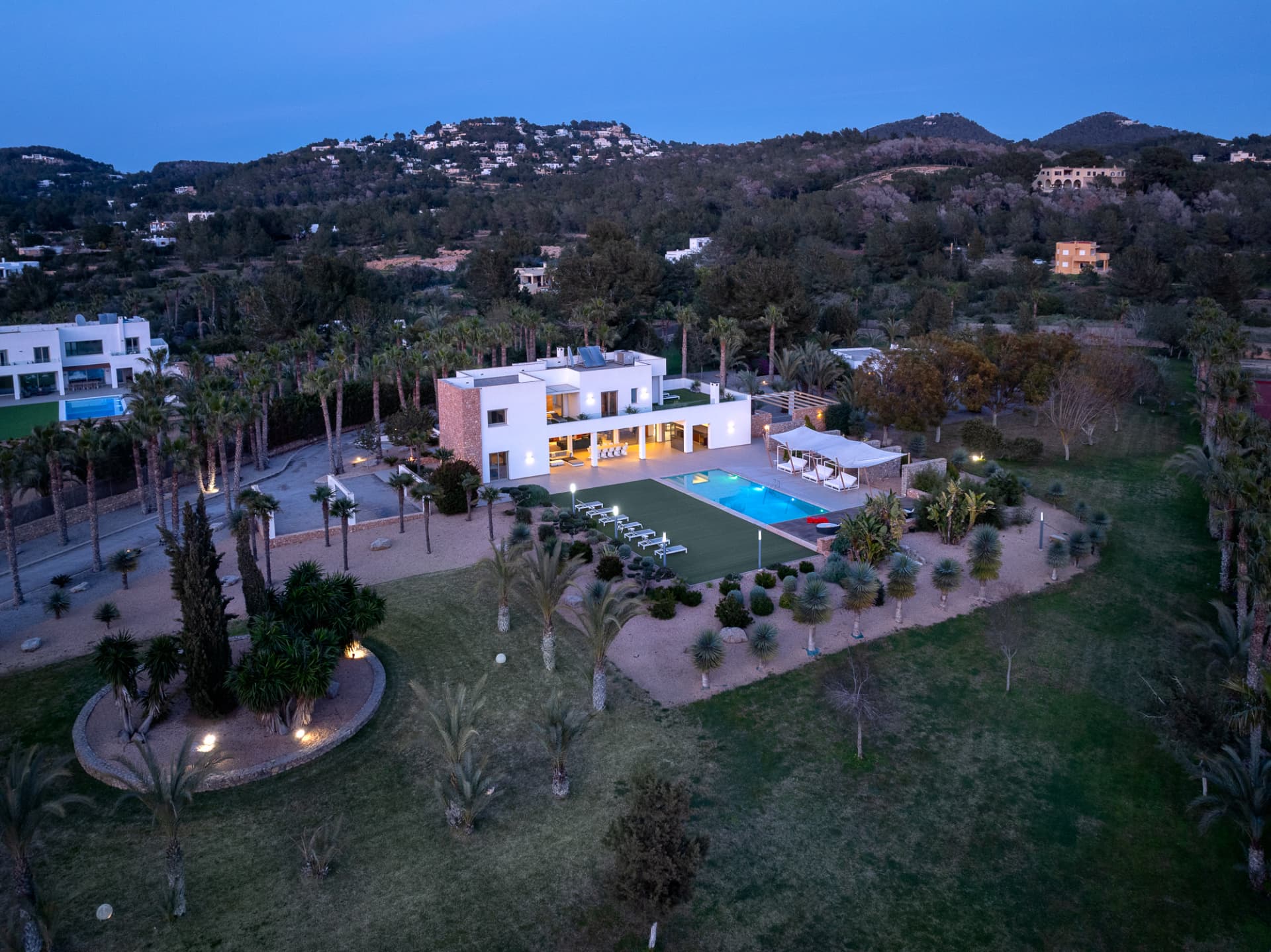 The villa and pool at dusk